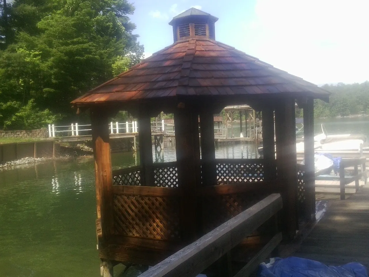 Cedar shake gazebo roof rebuilt on a lake dock in Dravosburg